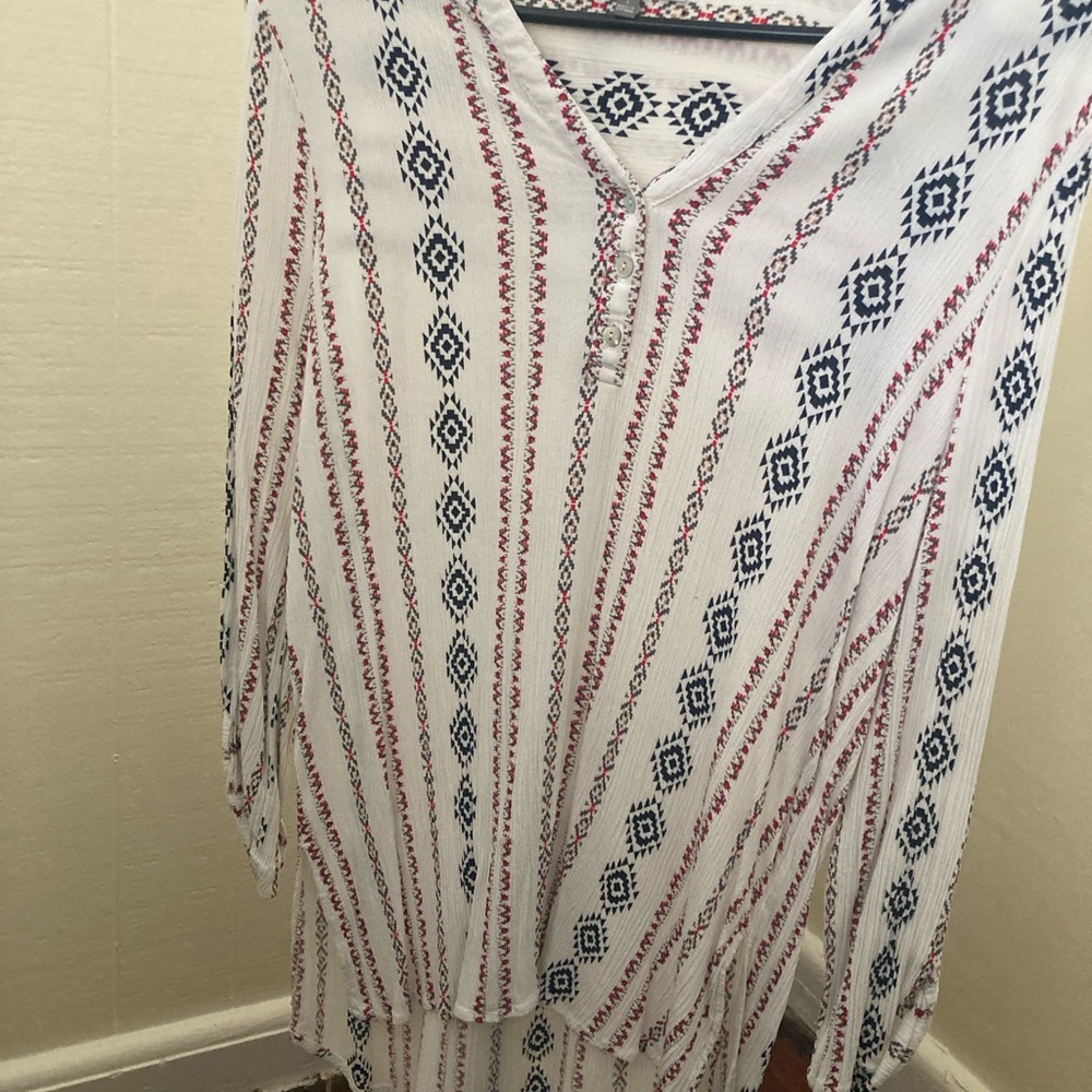 Western style tunic. Stretchy material but still fits nice and fitting.